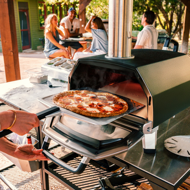 Ooni Ooni Karu Wood & Charcoal Fired Pizza Oven, 40cm in use