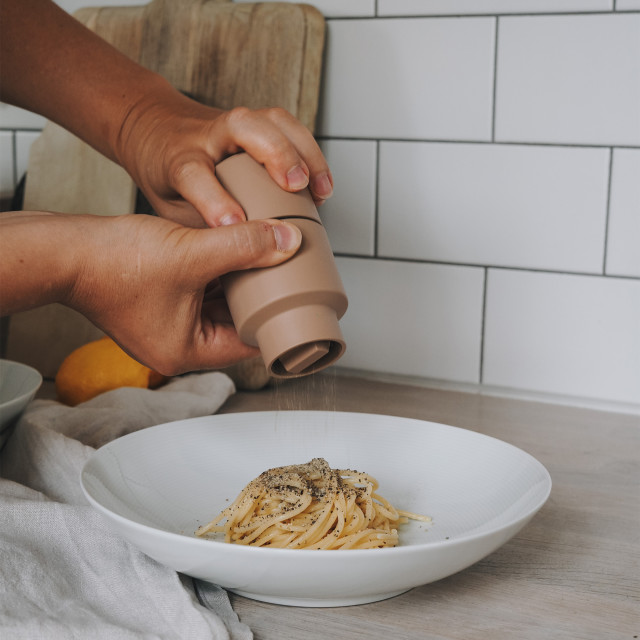 Crushgrind Billund Grinder - Cardomon with a bowl of spaghetti