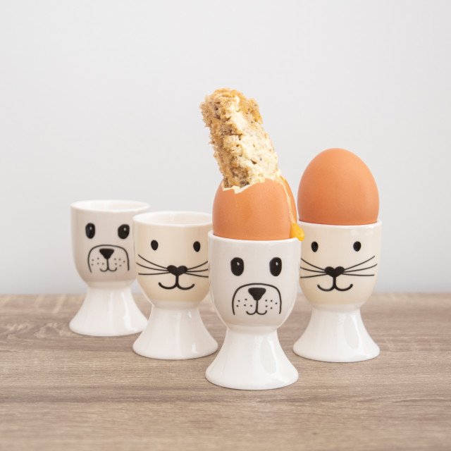 KitchenCraft Cat and Dog Egg Cups, Set of 4 in use