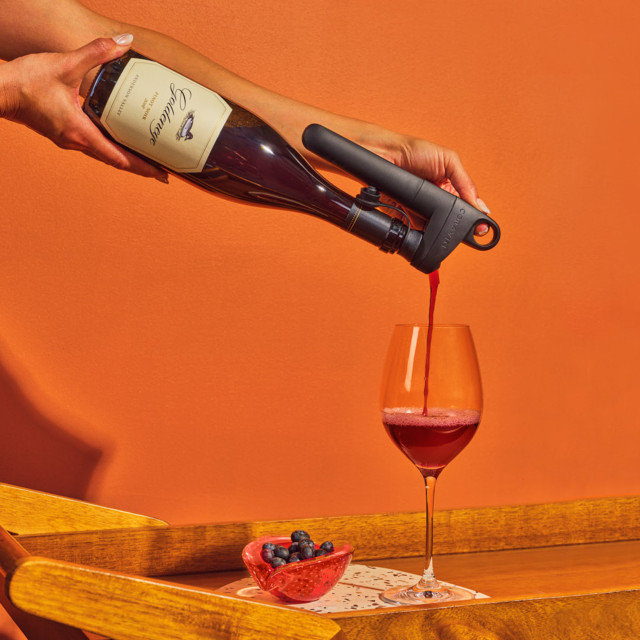 Coravin Pivot Wine Preservation System used to pour wine in the glass