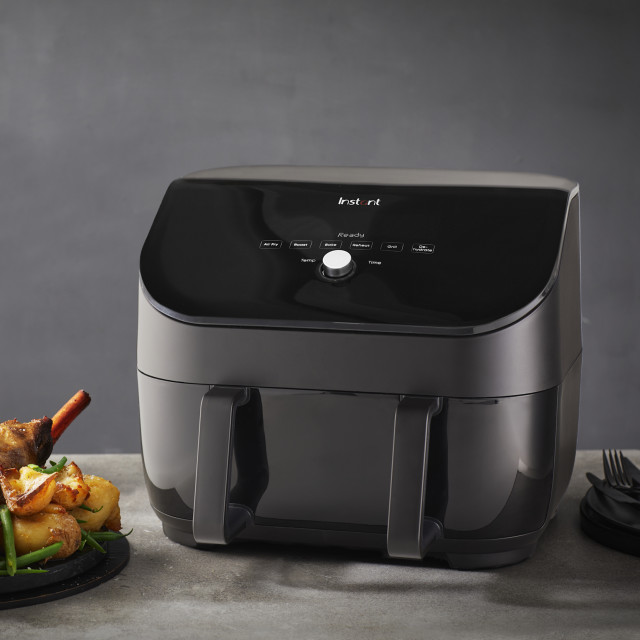 Instant Vortex Plus 8-In-1 Versazone Airfryer, 8.5L next to a roast