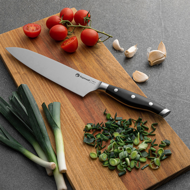Sagenwolf Performance Chef's Knife, 21cm on a wooden board with sliced chives