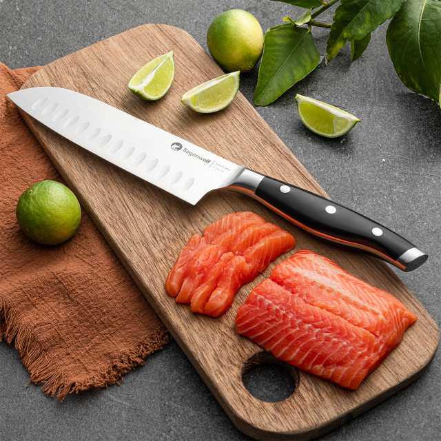 Sagenwolf Performance Santoku Knife, 18cm on a wooden Board with sliced salmon
