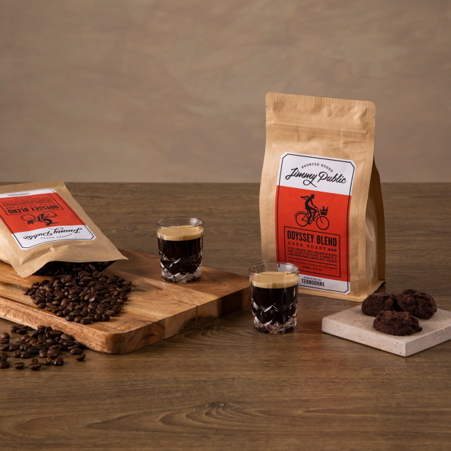 Jimmy Public Odyssey Blend Coffee Beans with two espresso shots and dark chocolate cookies