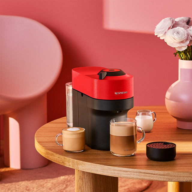 Nespresso Vertuo Pop Coffee Machine - Spicy Red on the table