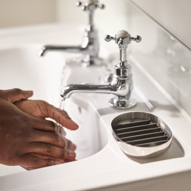 Joseph Joseph EasyStore Luxe Quick Drain Soap Dish with someone washing their hands