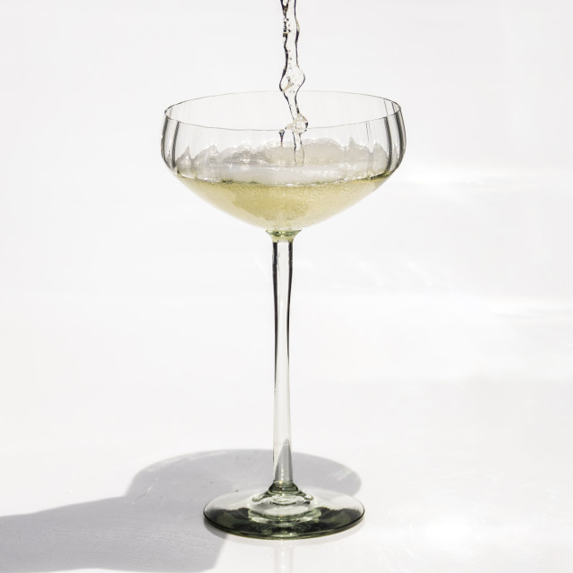 Ngwenya Glass Optic Vulindlela Champagne Coupe Glass with champagne being poured