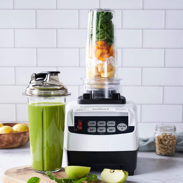 OmniBlend V Bullet Blender - White in a kitchen setting with smoothy ingredients ready to be blended