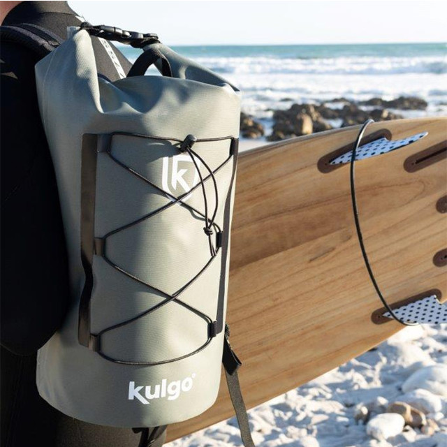 Kulgo Backpack Adventure Cooler, 20L with a surfboard