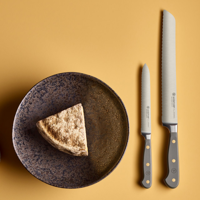 Wusthof Classic Sausage Knife, 14cm - Velvet Oyster on the table with a bowl