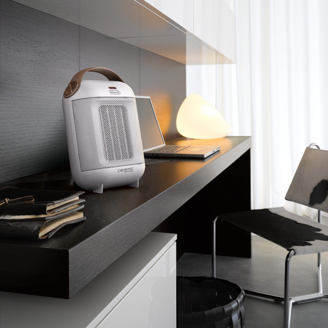 DeLonghi Ceramic Fan 1800W Heater, HFX30C18.AG - HFX30C18 - White on a desk