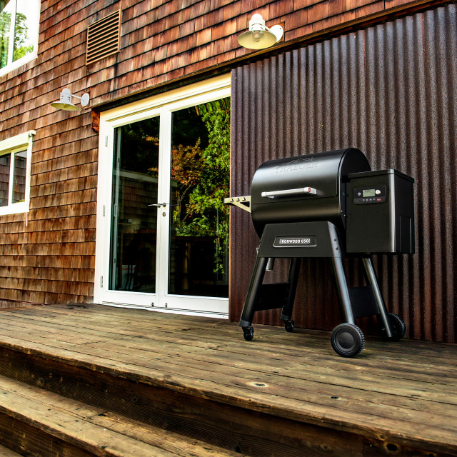 Traeger Ironwood 650 Wood Pellet Grill next to the door