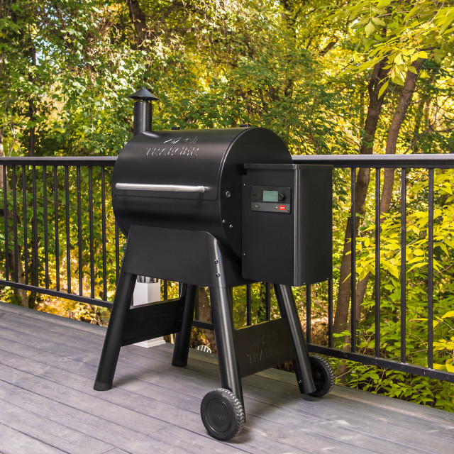 Traeger Pro 575 Wood Pellet Grill next to the balcony rail