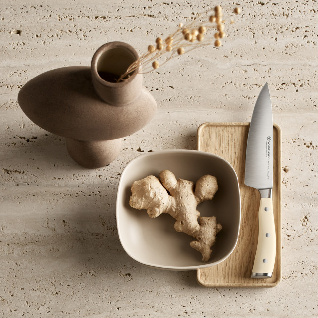 Wusthof Classic Ikon Creme Knife Block Set, 6-Piece on the chopping board with ginger