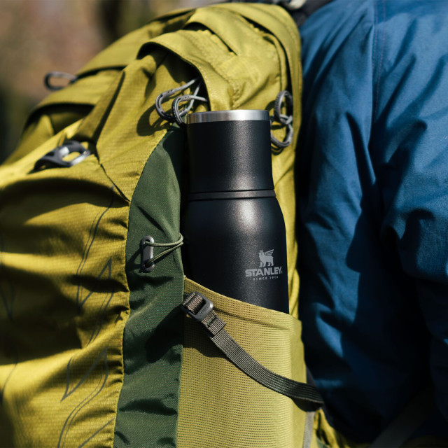 Stanley The Adventure To-Go Bottle, 740ml - Black packed in a backpack 