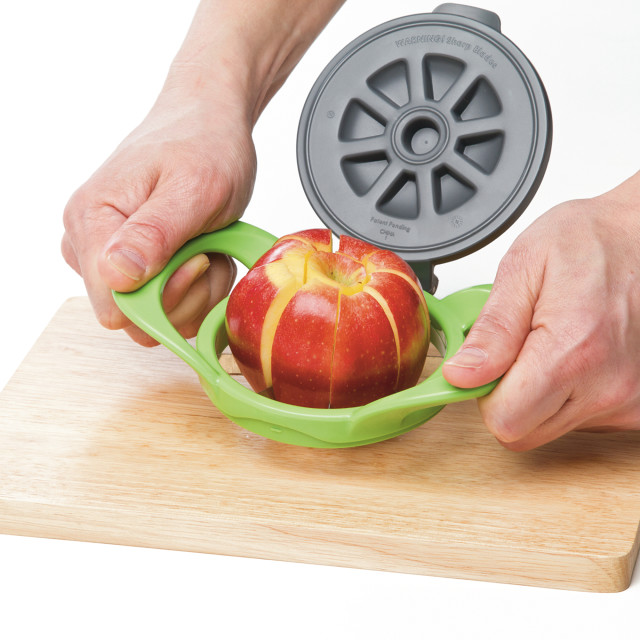 Progressive Apple Wedge And Pop cutting an apple