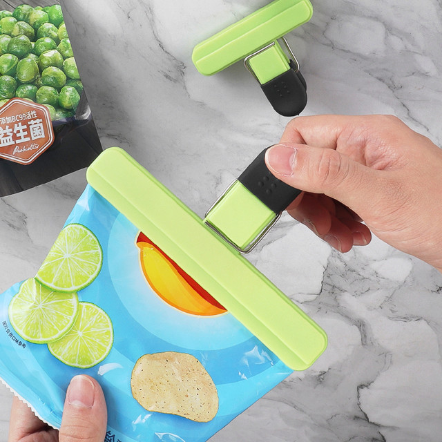 Creative Cooking Mixed Sizes Bag Clips clipping a packet of chips