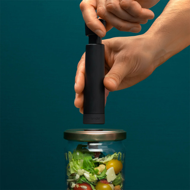 Vacuum pump in use on glass jar
