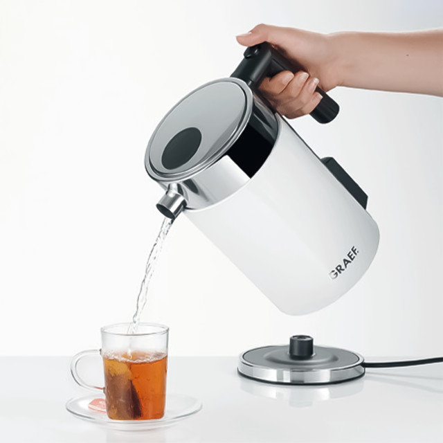 Graef Variable Temperature Cordless Kettle, 1.5L with boiled water pouring in a tea cup