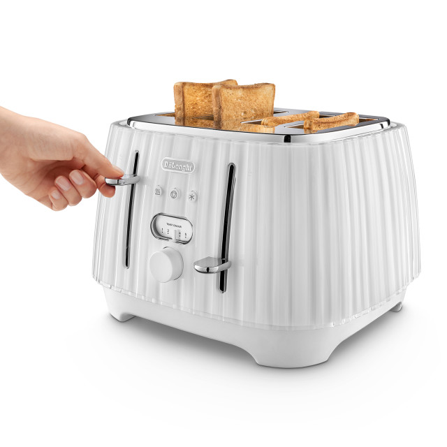 DeLonghi Ballerina 4-Slice Toaster, 1800W - Opaline White holding the metal wrapped touch points