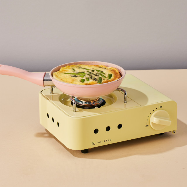 Tastelab Mini Cassette Gas Stove - Butter Yellow with a pan of eggs