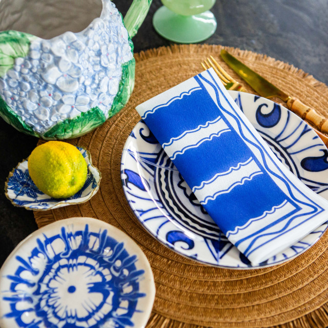 Tavola Stripe Biodegradable Paper Napkins, Pack of 25 blue on a plate