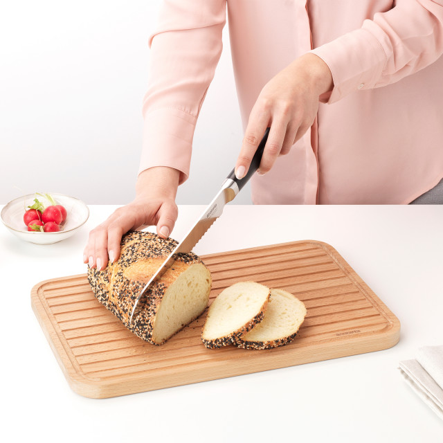 Brabantia Profile Wooden Chopping Board for Bread on the kitchen counter