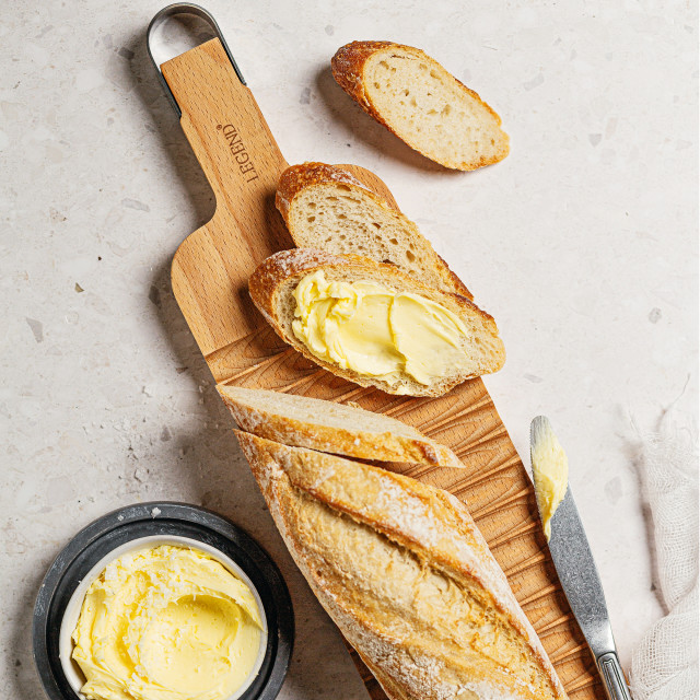 Legend Premium Beechwood Baguette Board with sliced bread
