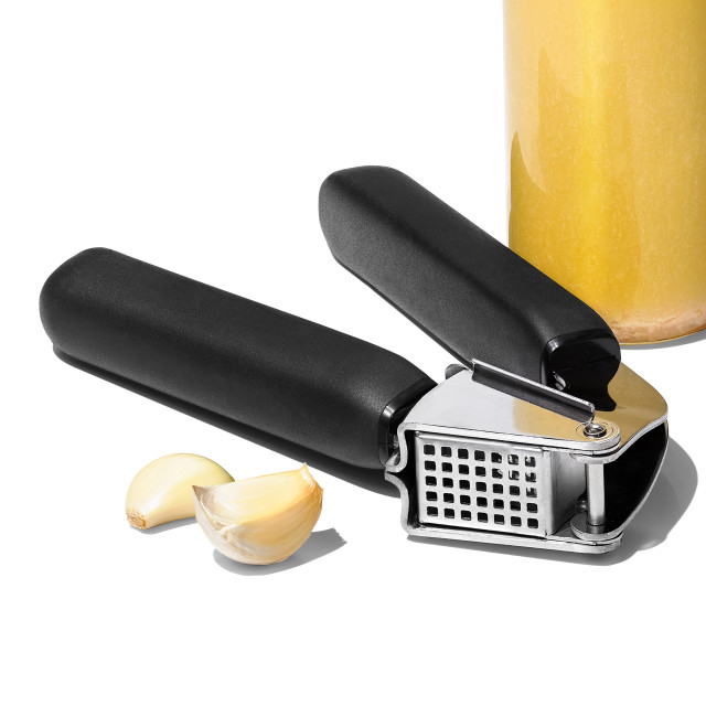 OXO Good Grips Stainless Steel Garlic Press with garlic