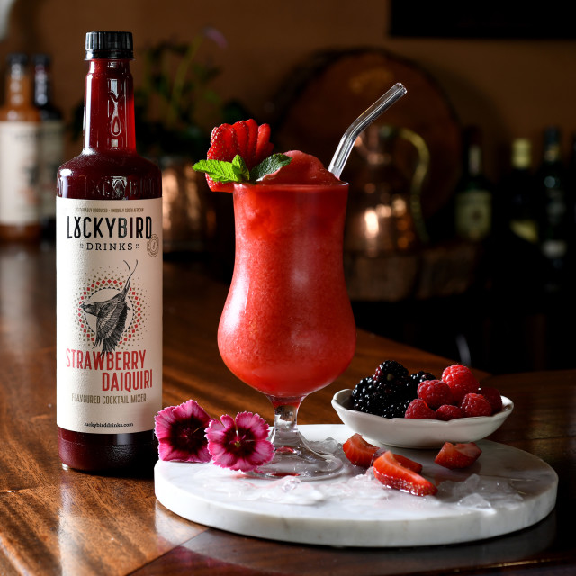 Luckybird Strawberry Daiquiri Cocktail Mixer, 750ml with a cocktail on a bar counter