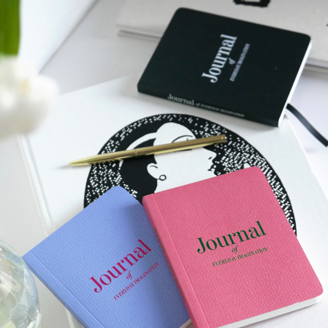 Printworks Pocket Notebook - Black with a blue and pink notebook on the table