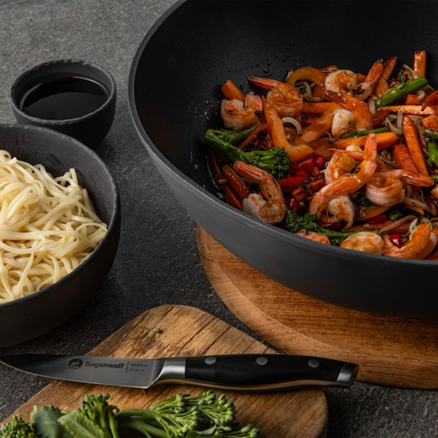 Sagenwolf Titanium Series Non-Stick Wok with Lid, 32cm - Black with prawns on the table