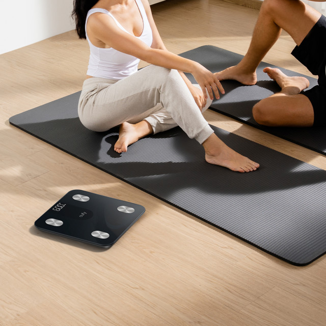 Eufy A1 Body Analysis Smart Scale - Black next to a yoga mat