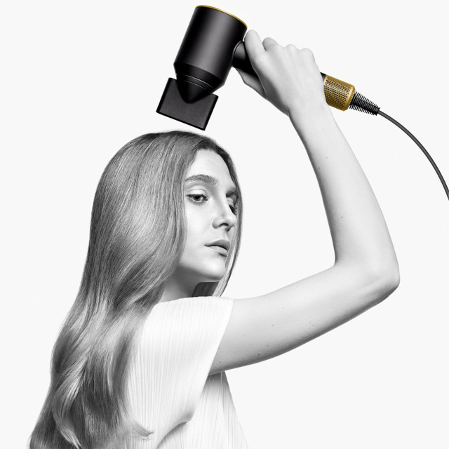 Dyson HD07 Nickel/Copper Supersonic Hair Dryer - Onyx/Gold drying hair