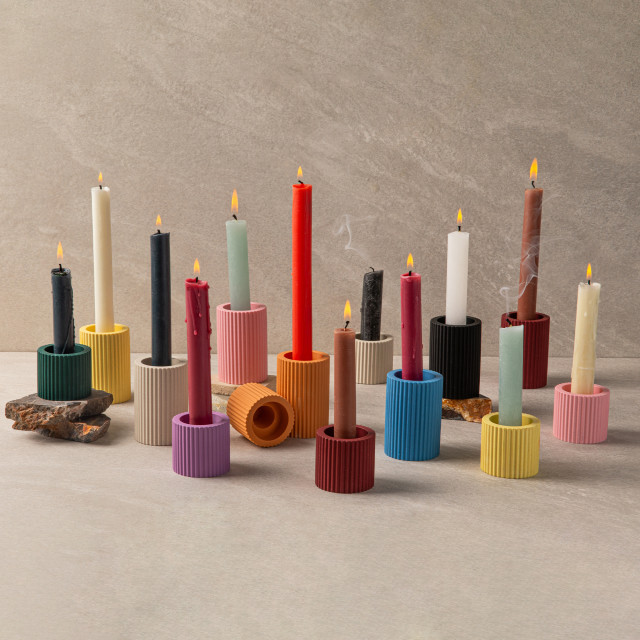 Alkaline Small Ribbed Candle Holders with candles lit