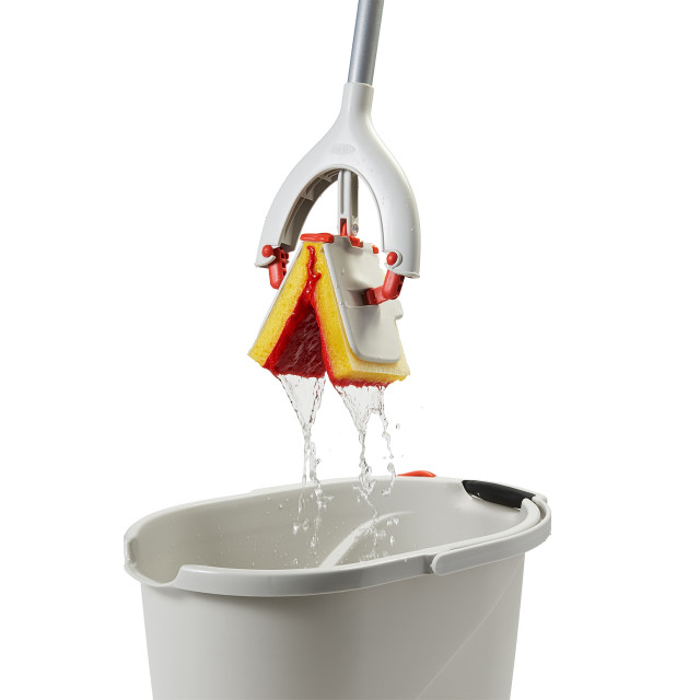 OXO Good Grips Butterfly Mop ringing water from the product 
