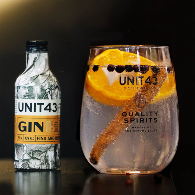 Unit 43 Distilling Company Mini Original Unit 43 Gin, 50ml with a poured glass of gin
