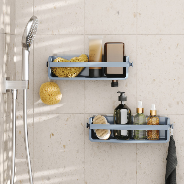 Umbra Flex Adhesive Shower Shelf - Slate Blue on a shower wall with soaps and accessories