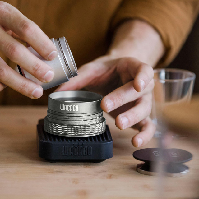 Wacaco Picopresso Portable Espresso Machine on the table with grind coffee