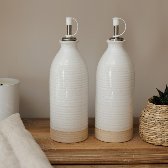 KitchenCraft Idilica Cream Oil and Vinegar Bottles, Set of 2 on the table