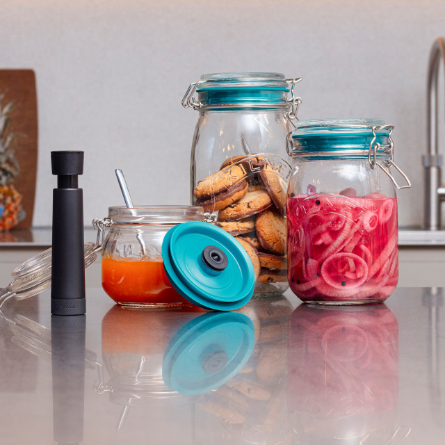 Airtender Vacuum Lid and Pump Set for Clip Top Jar on. the counter top with other jars