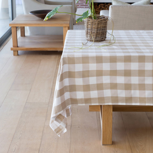 Linen House Revana Stone Check Tablecloth with a plant on the table