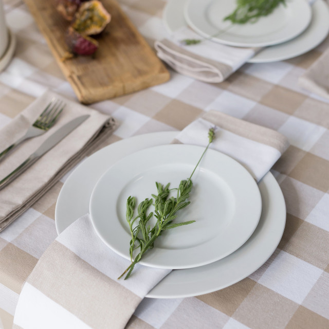 Linen House Revana Stone Check Tablecloth with plates and napkins