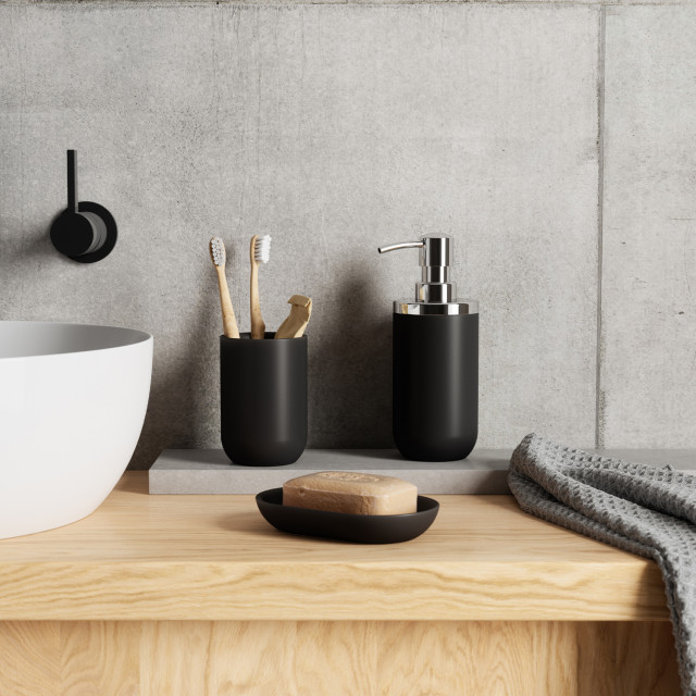 Umbra Junip Pump Soap Dispenser - Black with a soap dish next to the basin