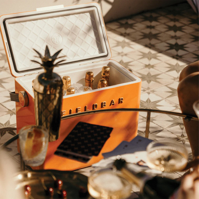 Fieldbar Gin Trunk - Orchard Orange with bottles of champagne