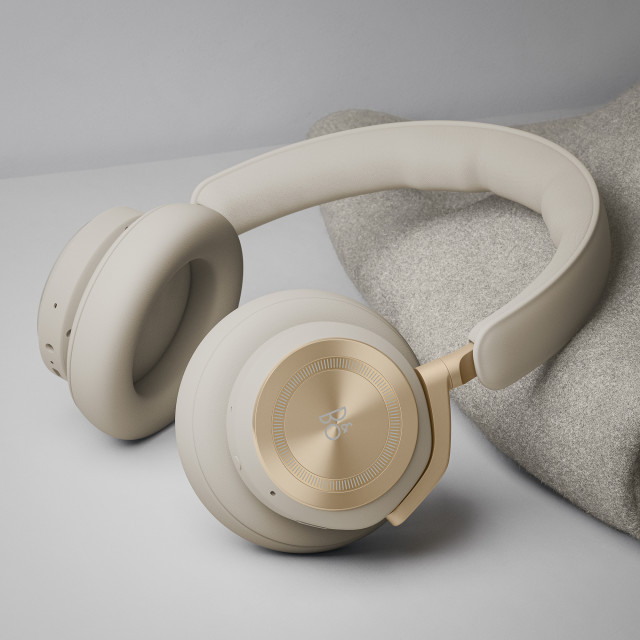 Bang & Olufsen Beoplay HX Headphones - Gold Tone on the table
