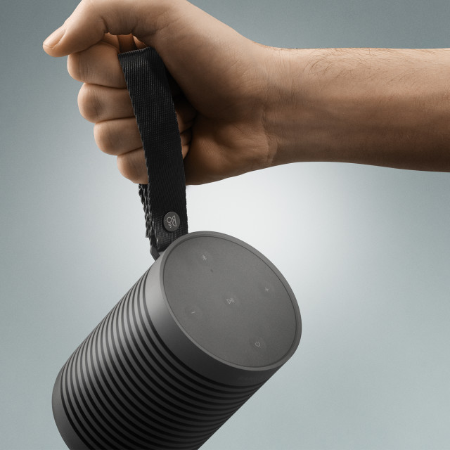 Bang & Olufsen Beosound Explore Outdoor Bluetooth Speaker - Black Anthracite showing scale in hand
