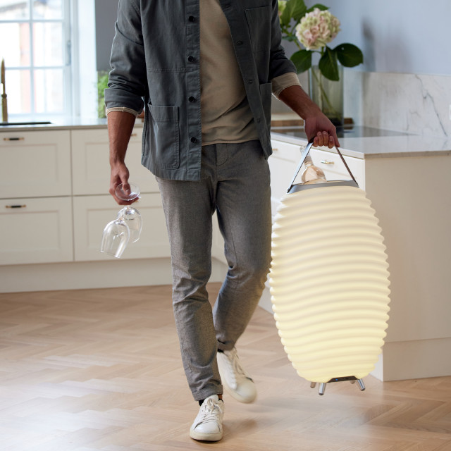 Kooduu Synergy Large Wine Cooler Lamp carried with a bottle of wine