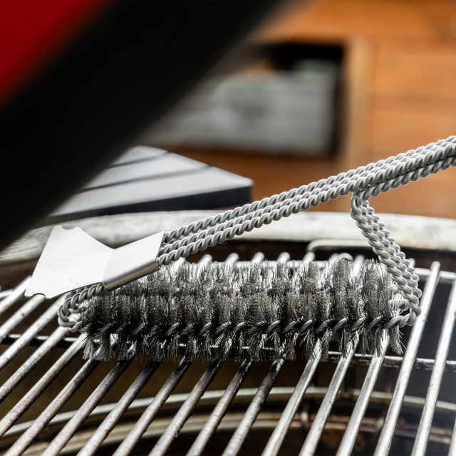MasterClass BBQ Bristle Spiral Grill Brush on the grill rack