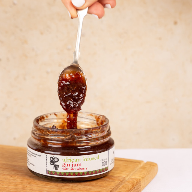 Chaloner Gin and Strawberry Jam, 200g on the table with a spoon